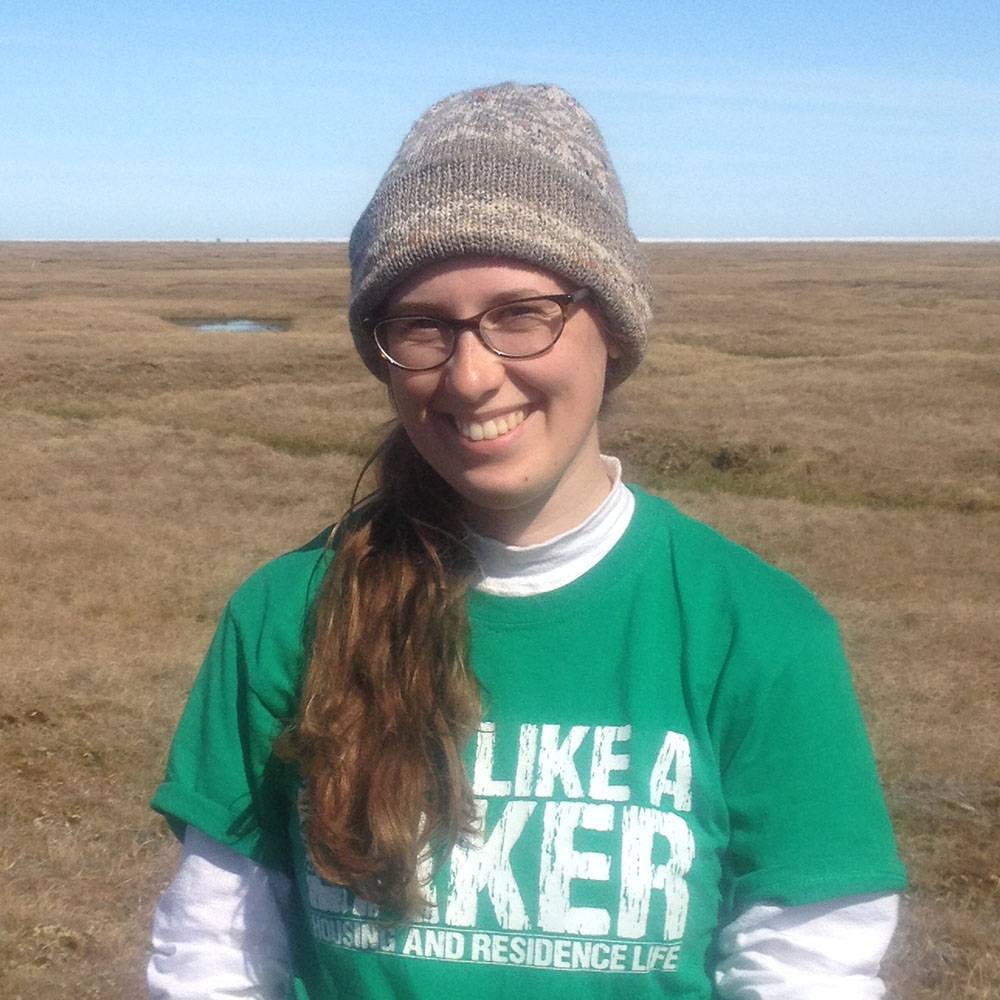 Kelsey smiles in the tundra.
